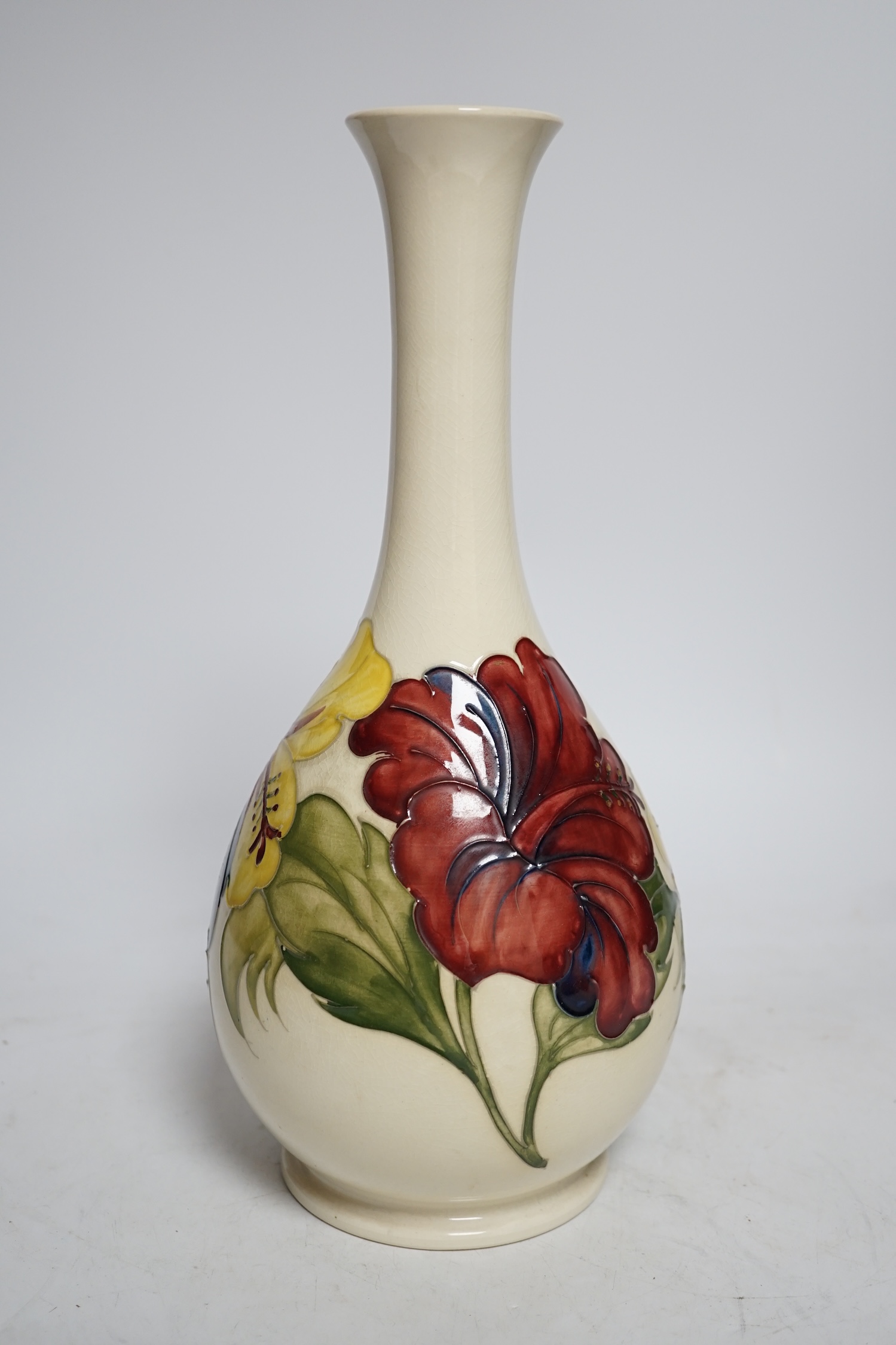 A Moorcroft cream ground Hibiscus vase, 31cm high